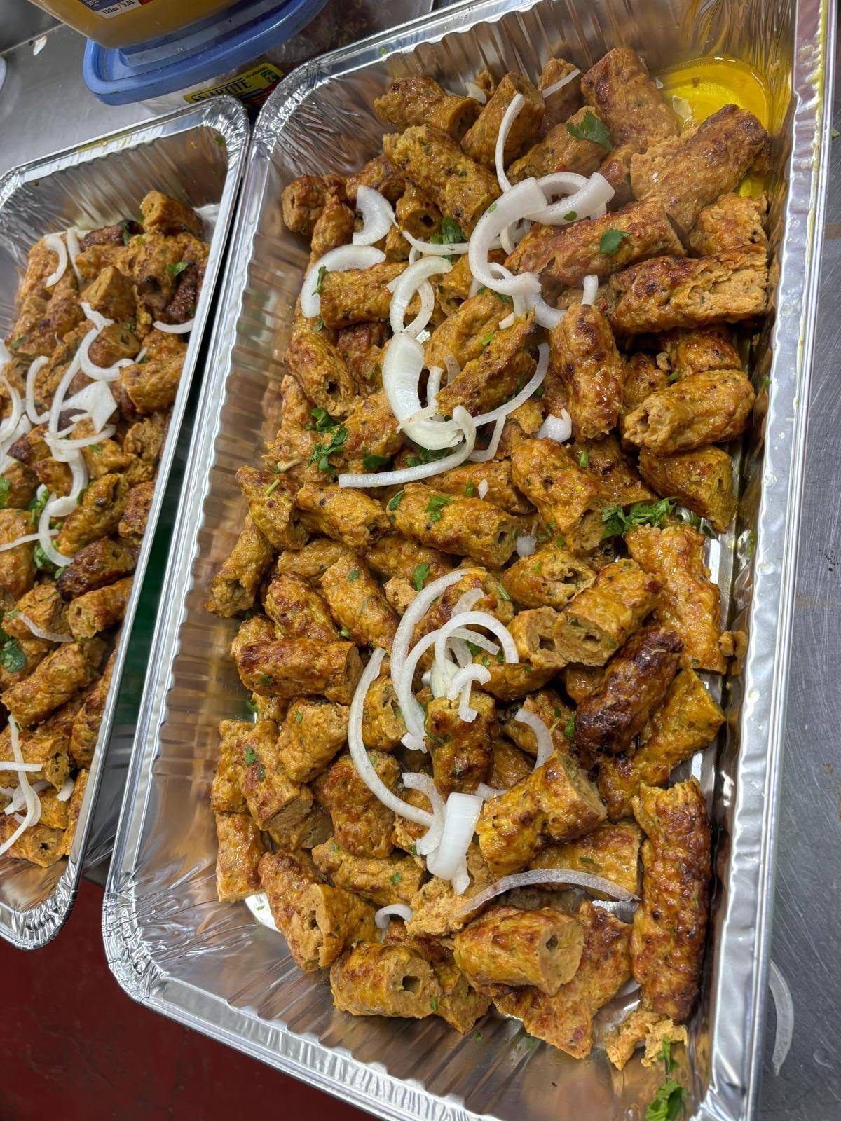 Seekh kebabs packed in a catering tray